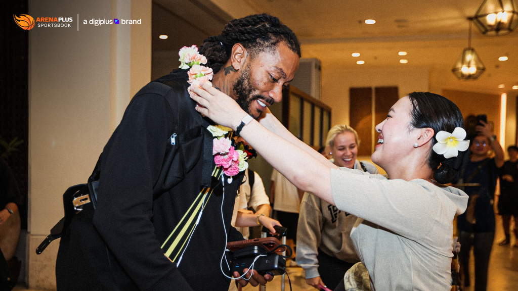 Derrick Rose receives a warm welcome and a lei flower garland upon his arrival in Cebu.